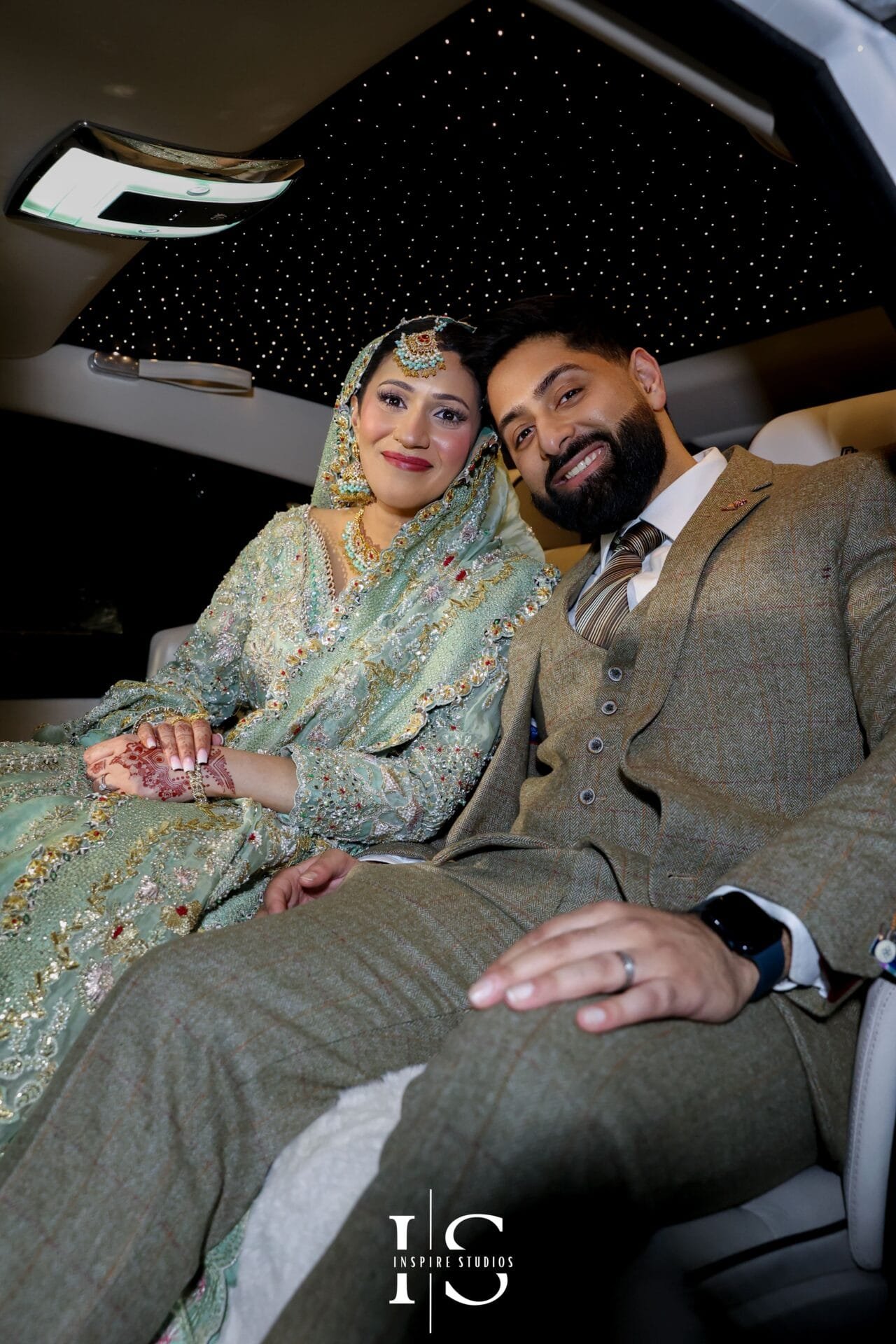 Bride and groom posing for a wedding portrait at Hylands House, Chelmsford.