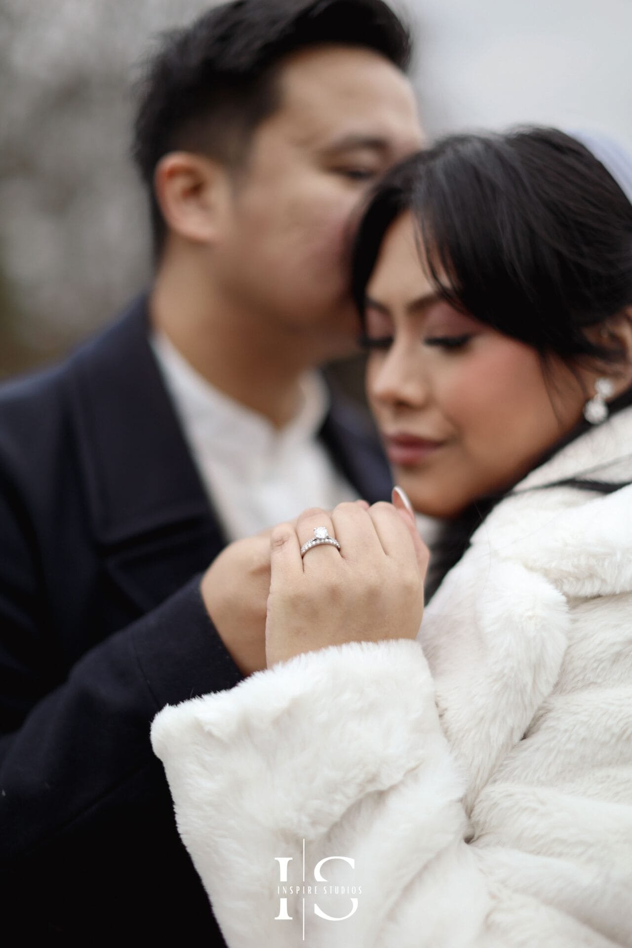 Filipino bride and groom posing together for natural wedding portraits at Danson Park, Bexley.