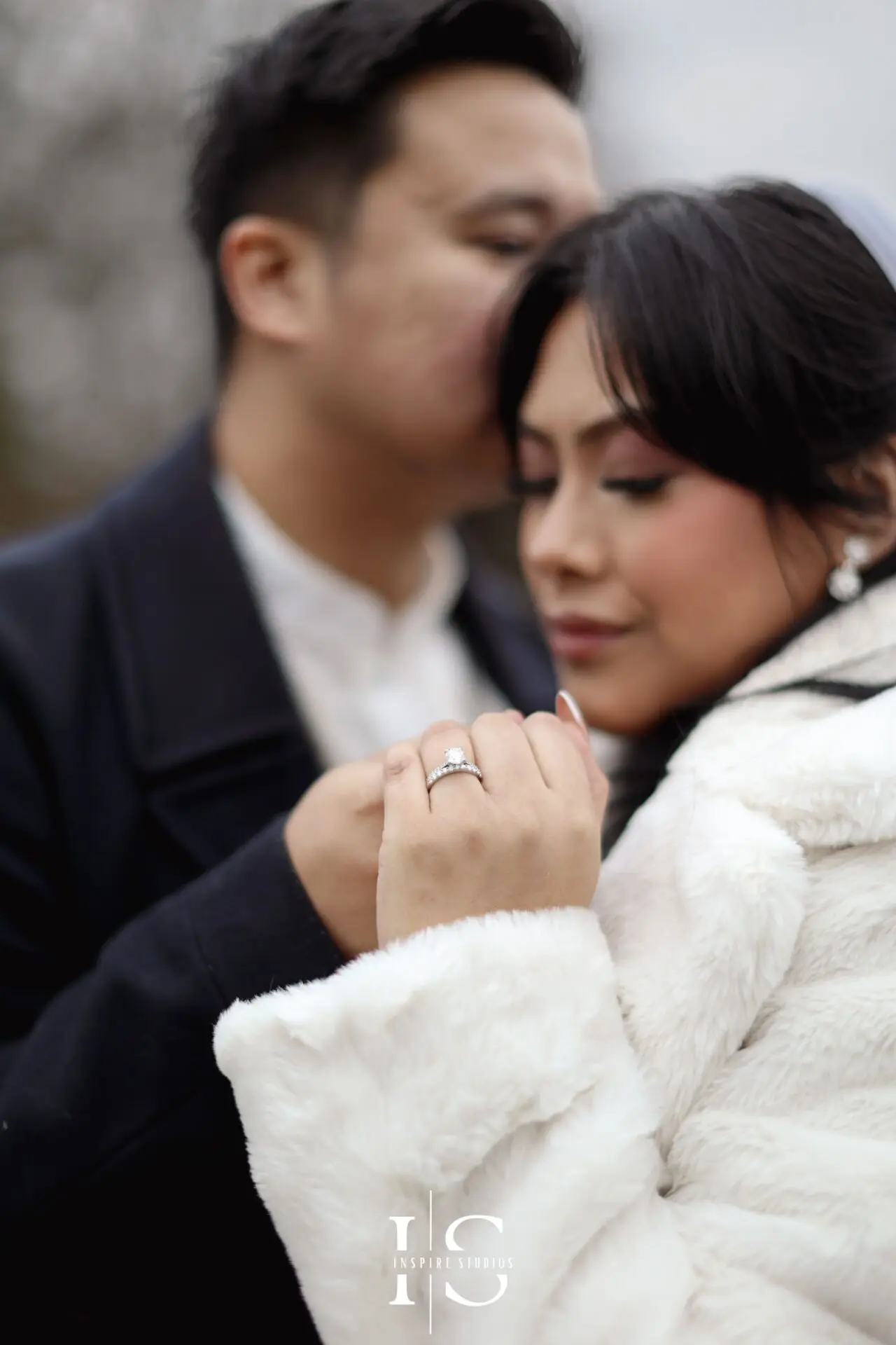 Filipino bride and groom posing together for natural wedding portraits at Danson Park, Bexley.