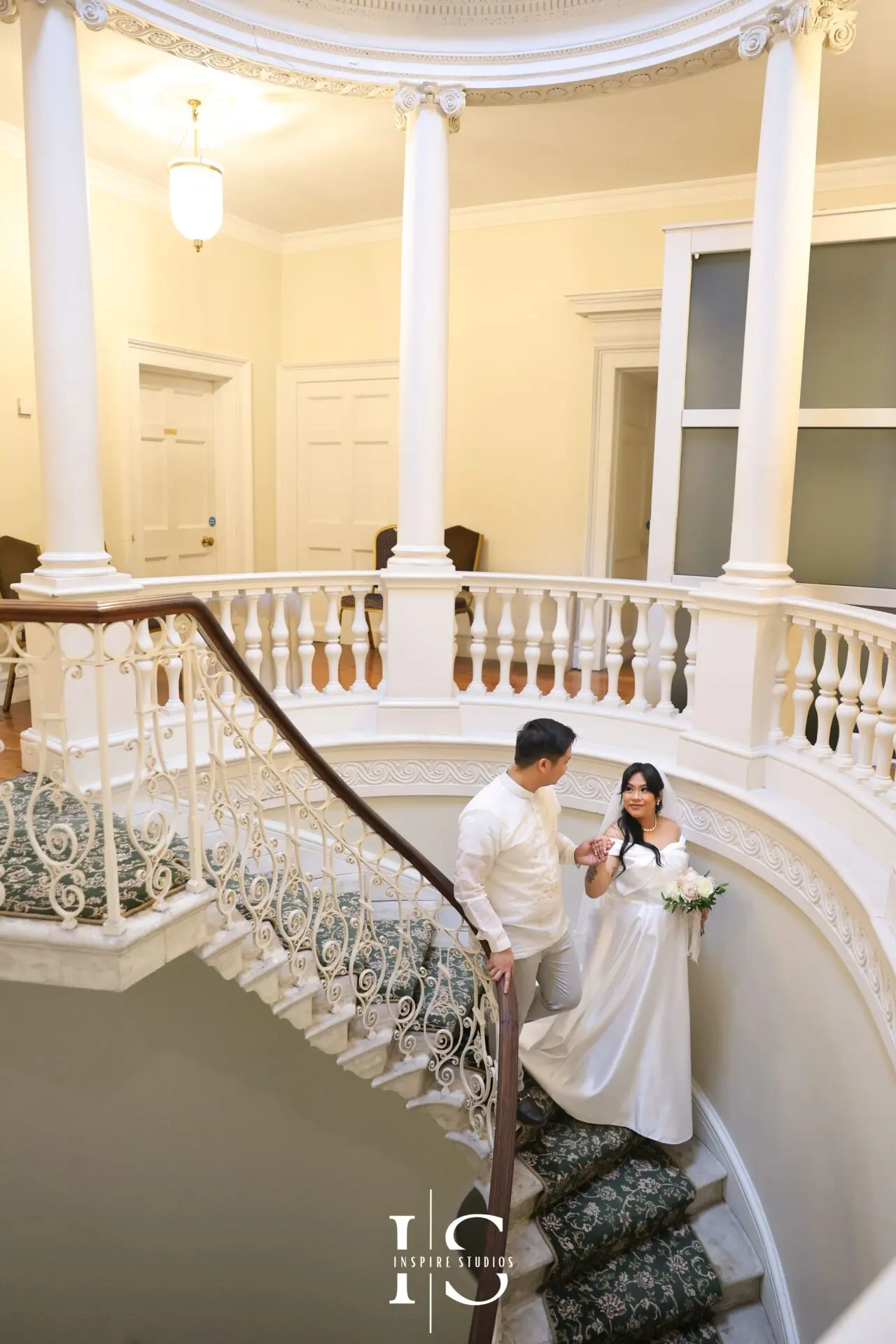 Filipino bride and groom photographed during their wedding celebration at Danson House in Bexley.