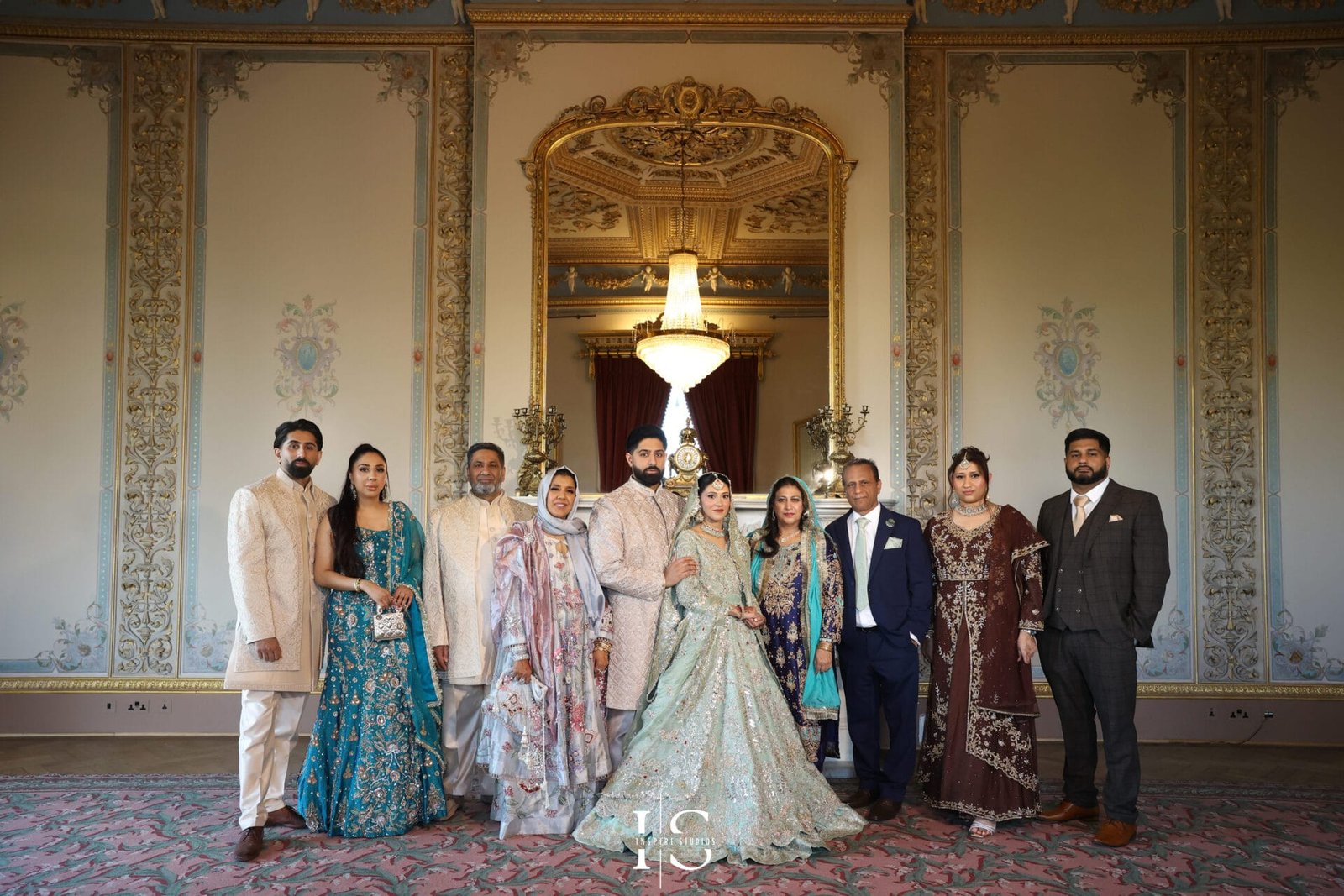 Family group posing for wedding photography at Hylands House, Chelmsford.