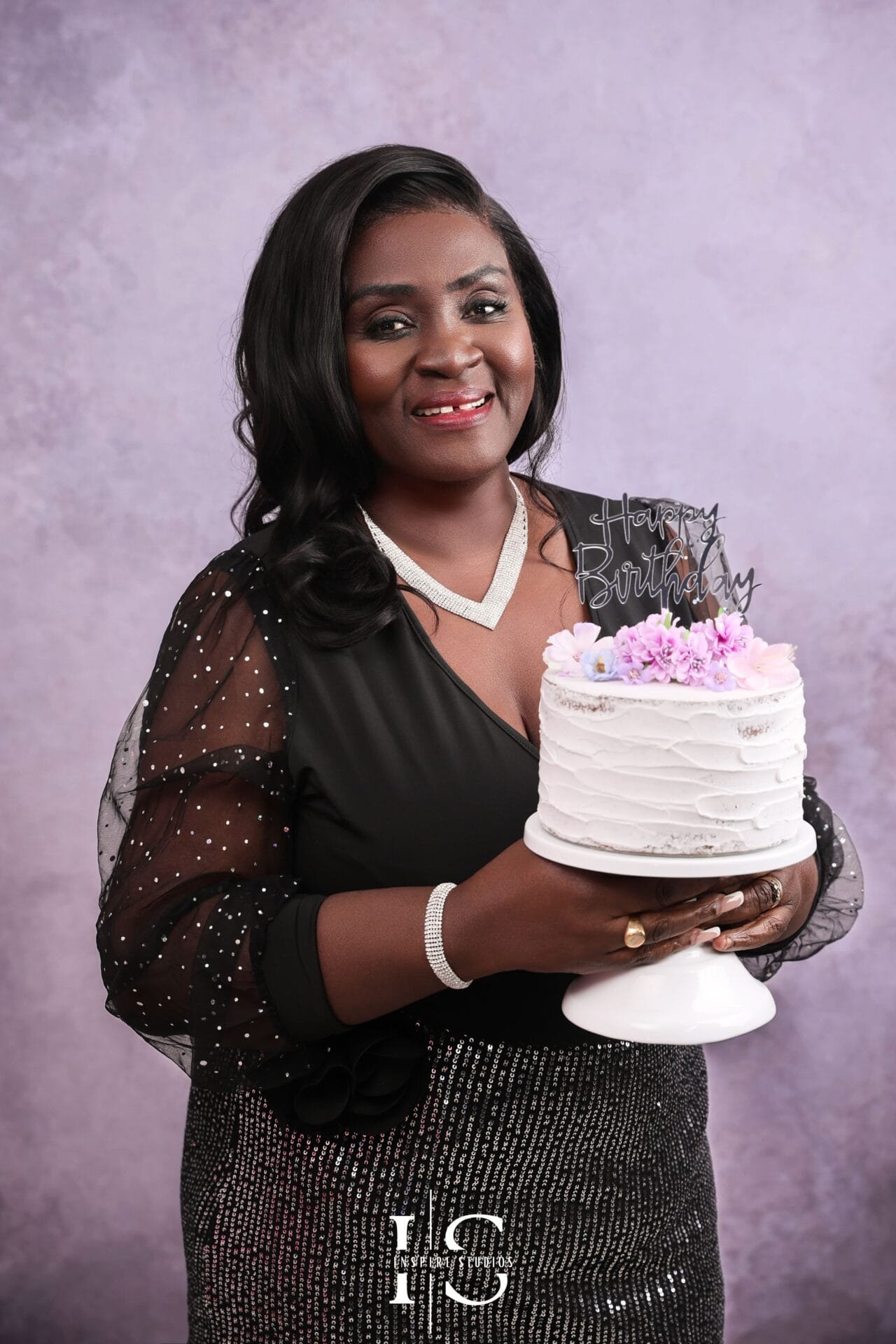 Milestone birthday photoshoot in a professional studio with elegant portrait styling