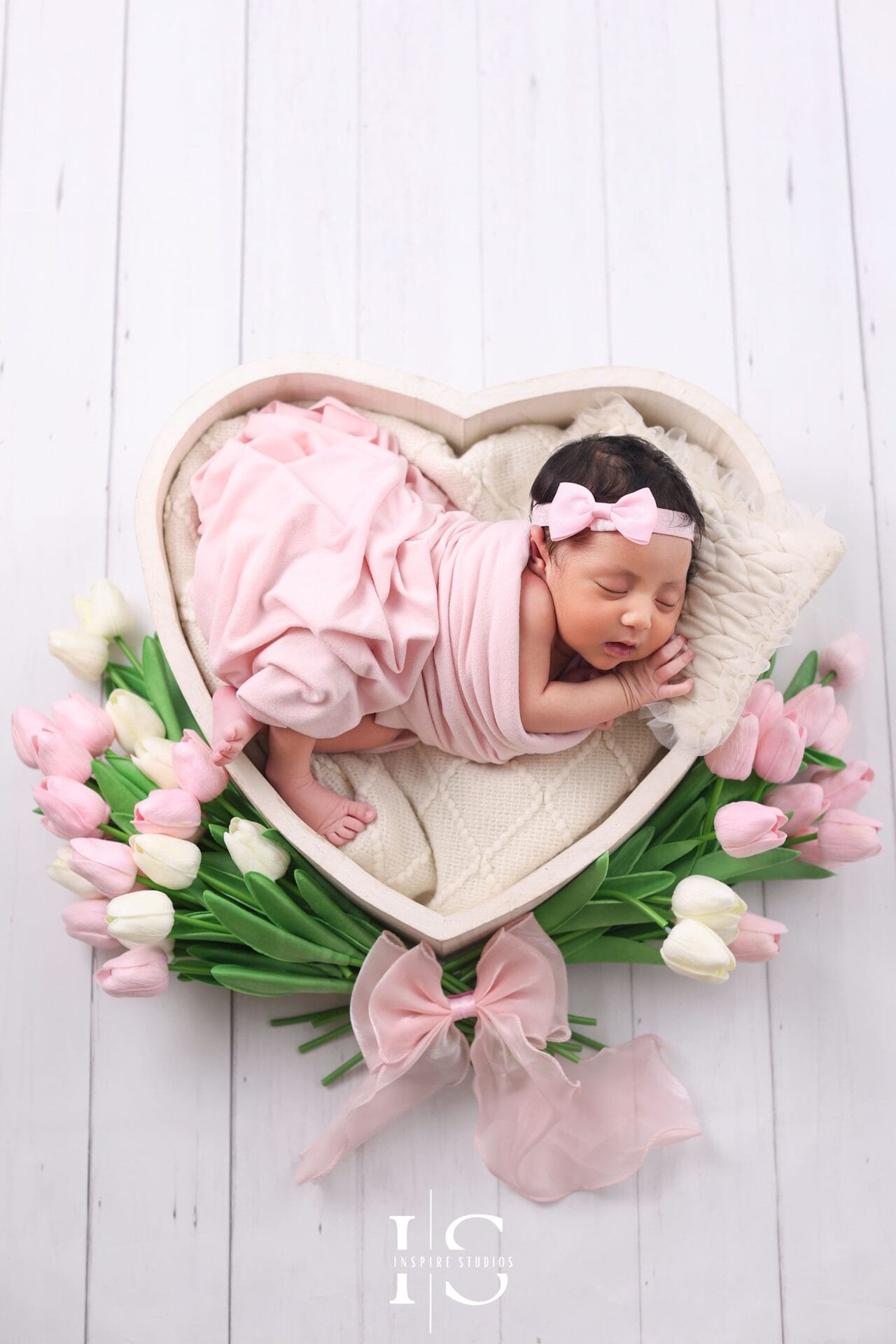 Newborn baby girl photography in East London with a soft studio setup for baby portraits.