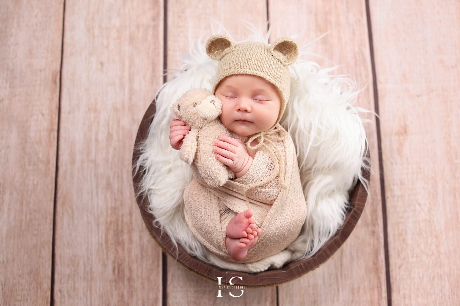 Newborn baby and family photography in East London with parents and sibling in a studio photoshoot.