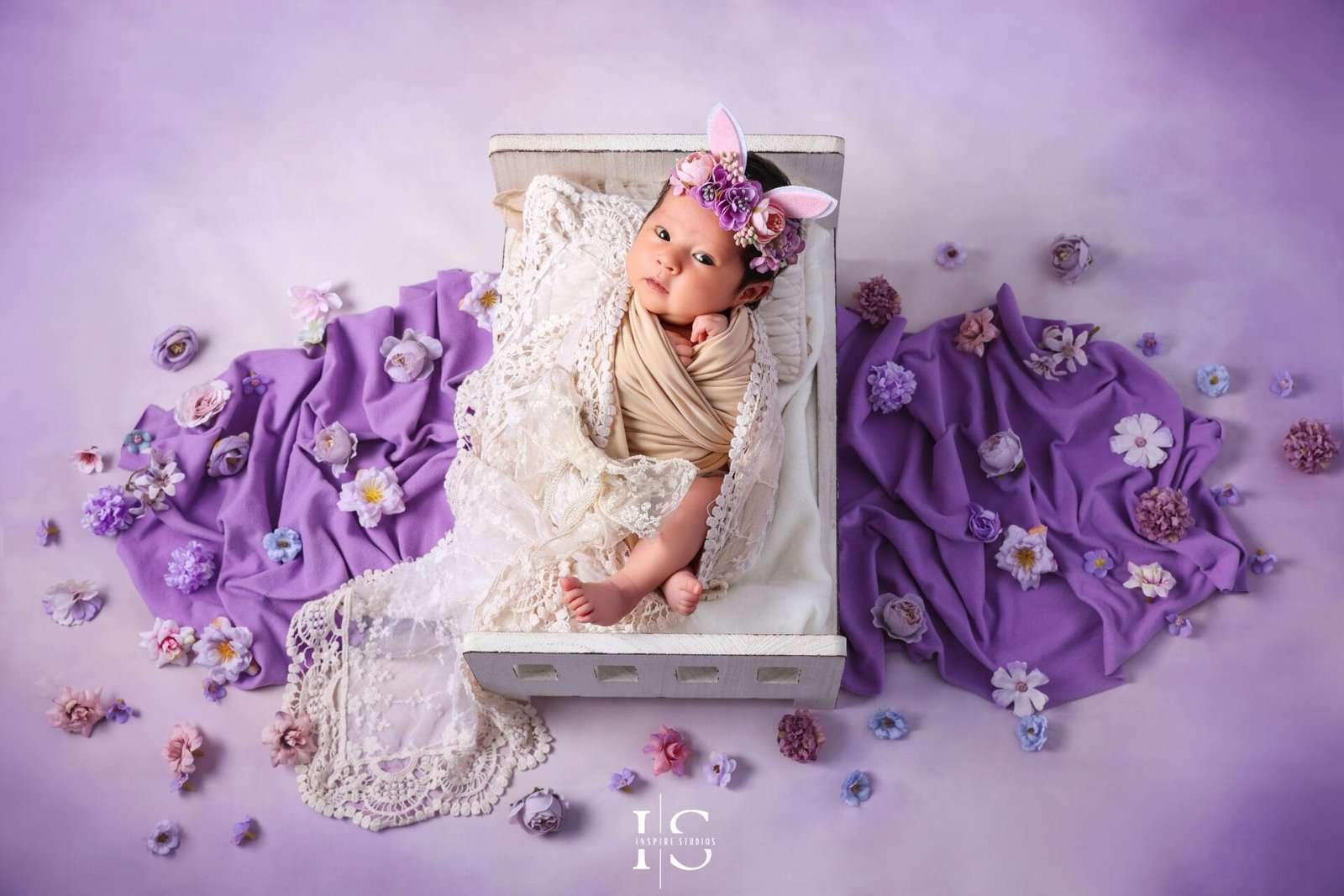 Newborn photoshoot at Inspire Studios in London with a purple baby photography setup.