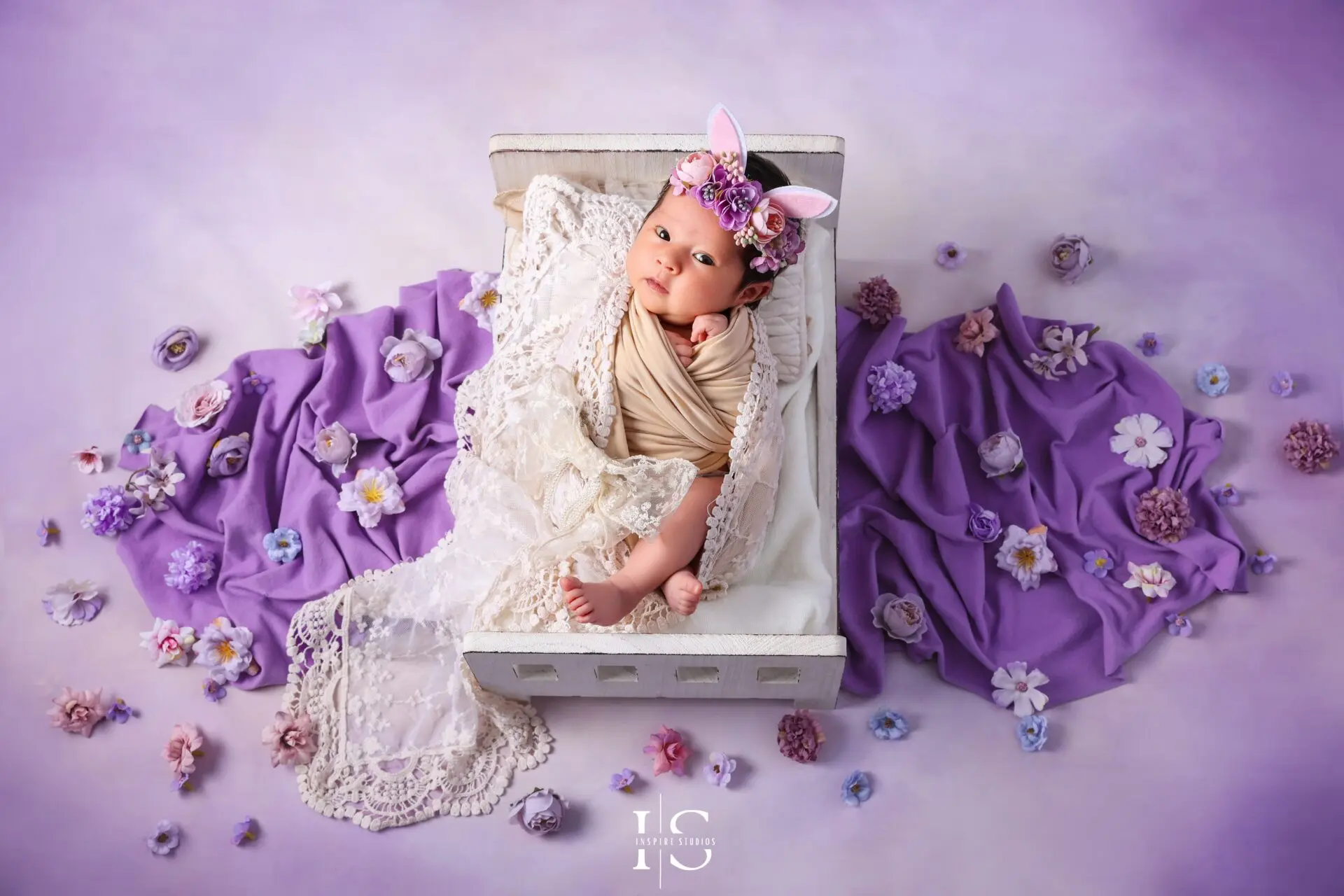 Newborn photoshoot at Inspire Studios in London with a purple baby photography setup.