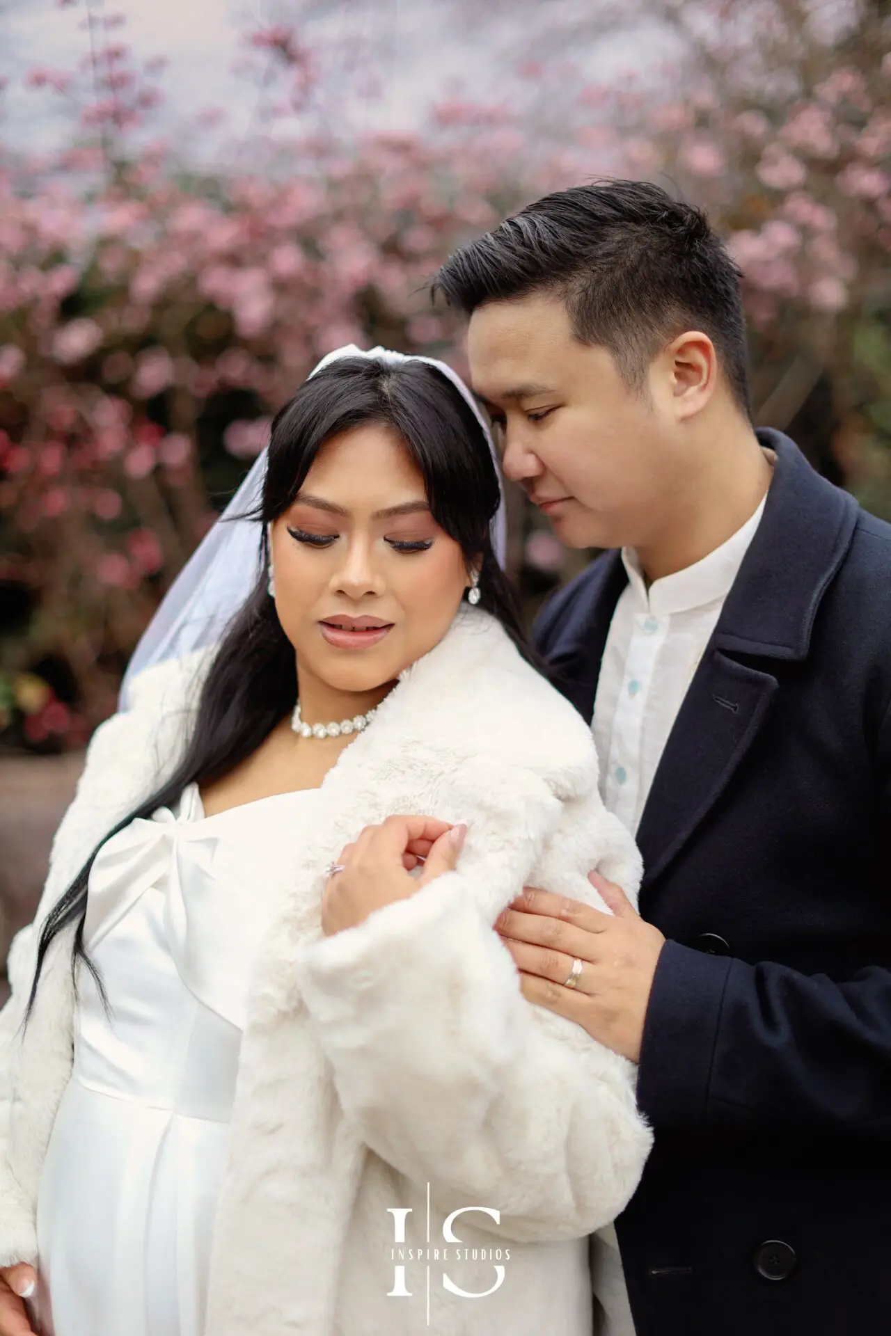 Filipino newlywed couple posing for natural outdoor registry wedding portraits near Danson House in Bexley.
