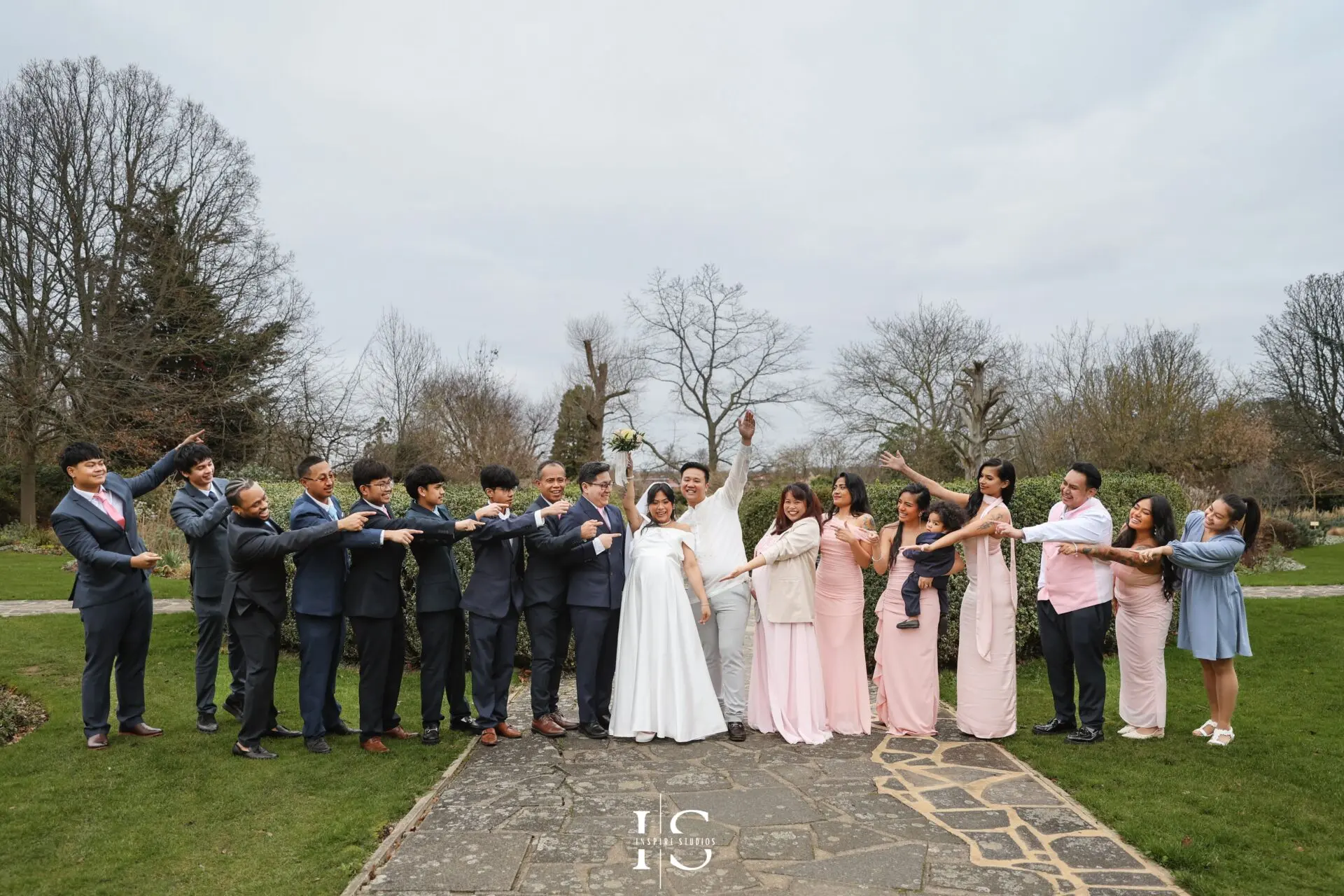 Outdoor registry wedding portrait of a Filipino bride and groom beside Danson House in Bexley, London.