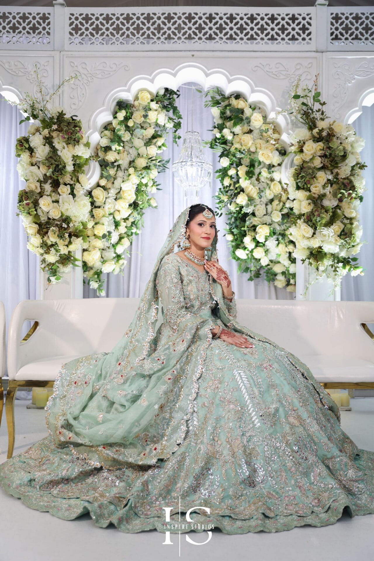 Bride in Pakistani wedding attire posing inside Hylands House, Chelmsford.