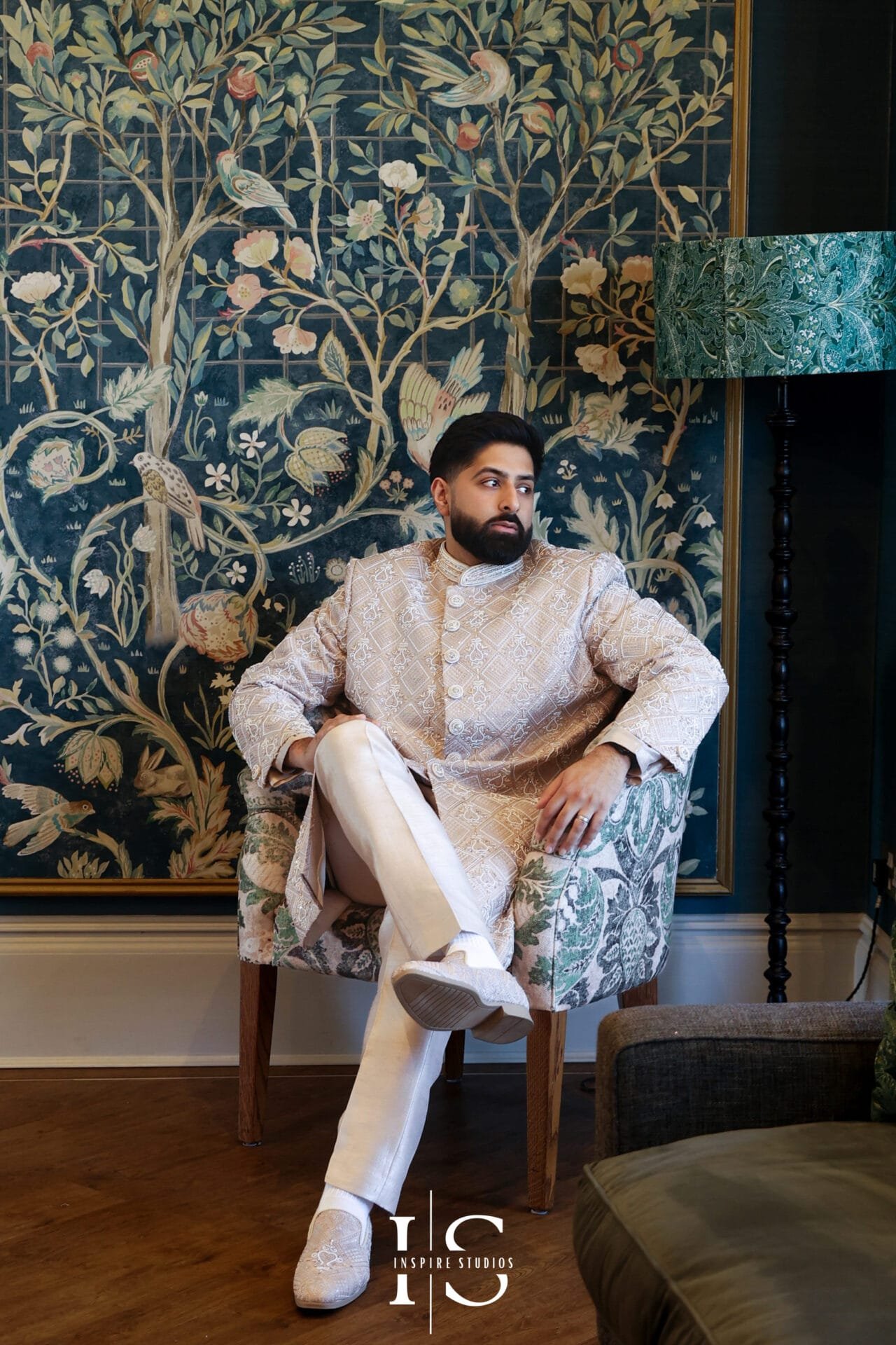 Pakistani wedding groom posing for a portrait inside Hylands House.