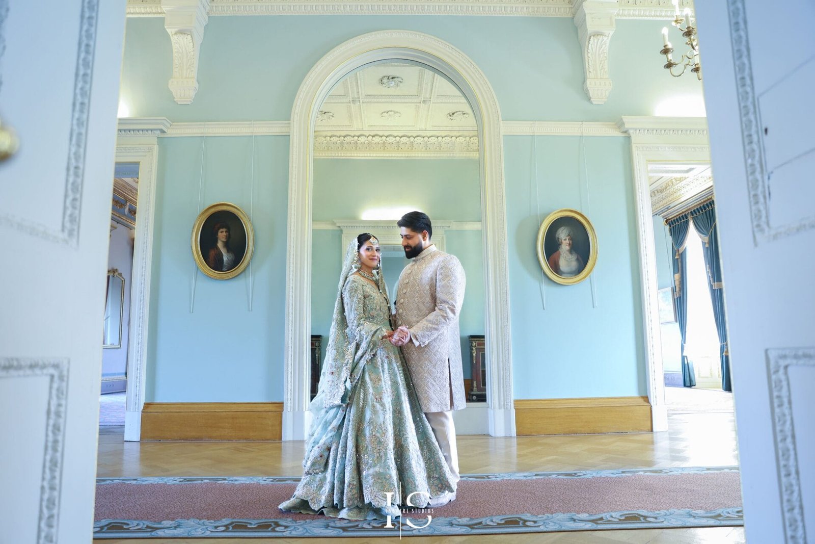 Pakistani bride and groom photographed together at Hylands House, Chelmsford.