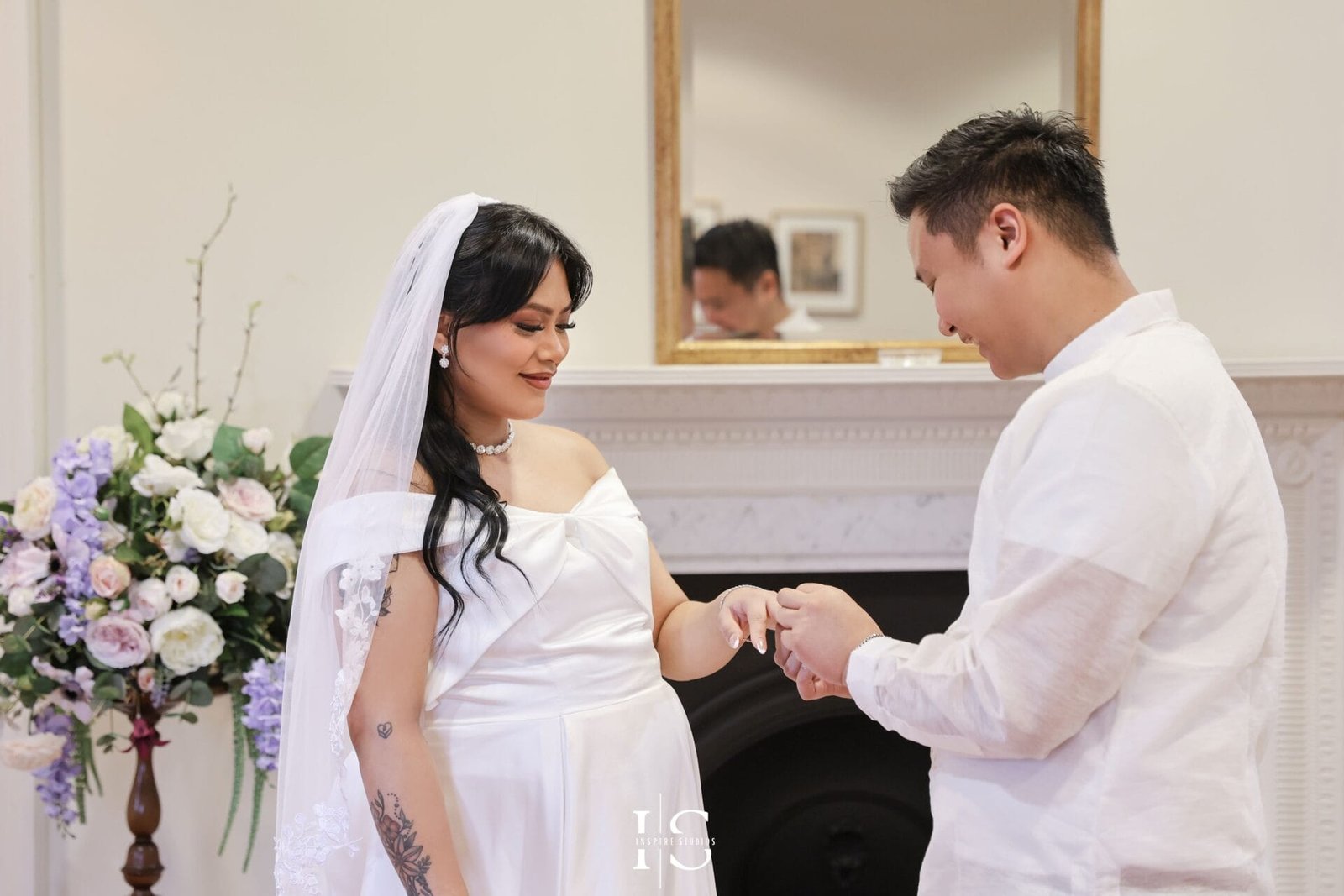 Filipino bride and groom photographed during their civil wedding at Danson House registry venue in Bexley, London.