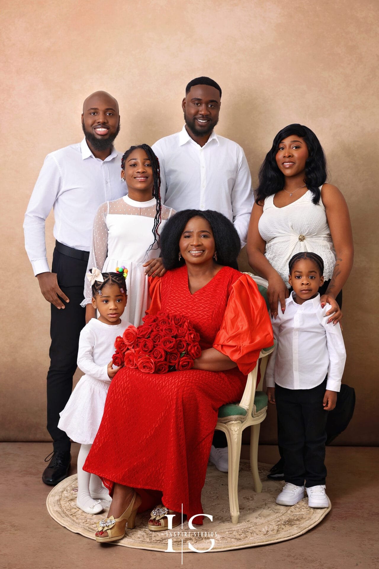 Senior birthday family photoshoot in London with loved ones in a studio setting