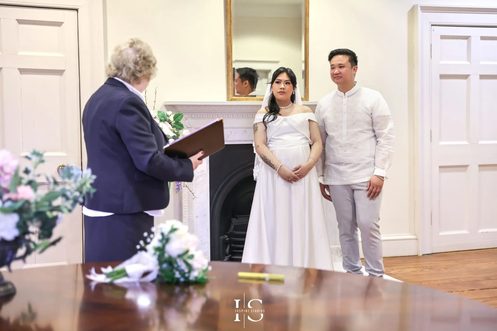 Wedding photographer capturing a bride and groom at Danson House in Bexley after their civil ceremony.
