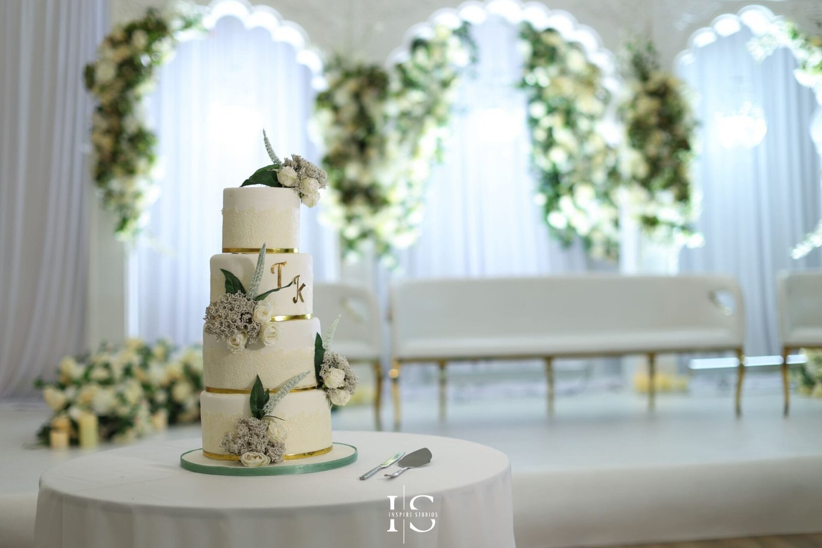 Bride and groom celebrating their wedding at Hylands House in Chelmsford.