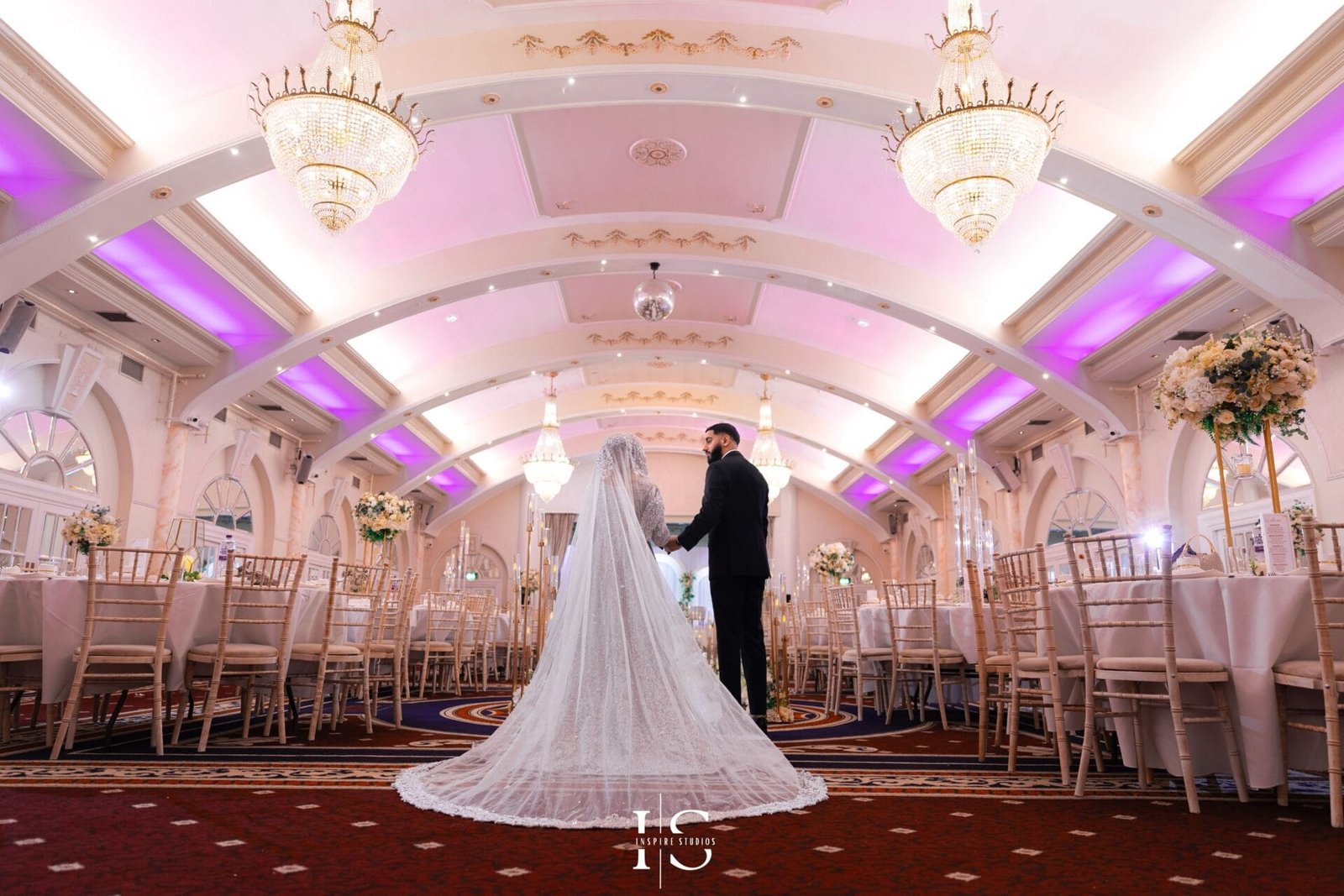 Female wedding photographer at The Decorium in London capturing the couple’s wedding day for Inspire Studios.