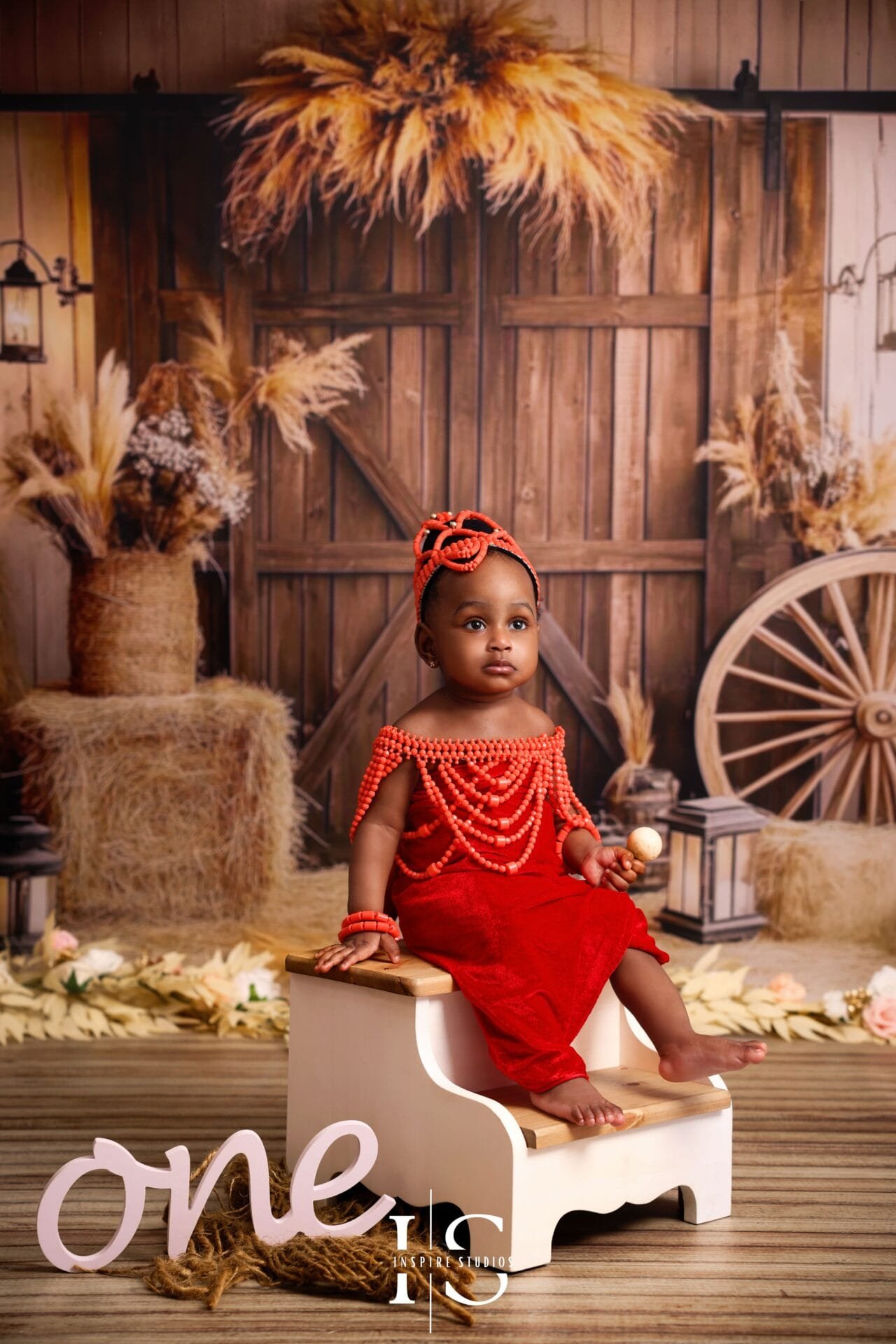 Child celebrating their first birthday during a boho-themed kids photoshoot in a London studio.