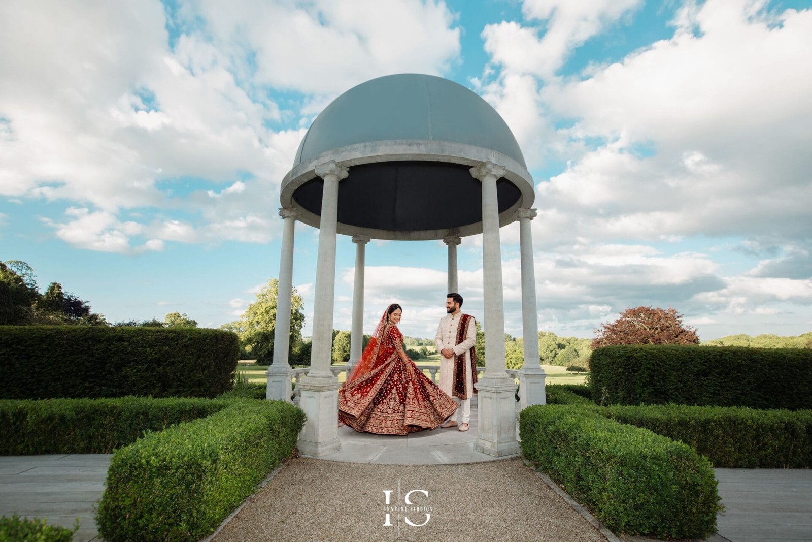 Female wedding photographer capturing a couple at Froyle Park Country Estate wedding venue