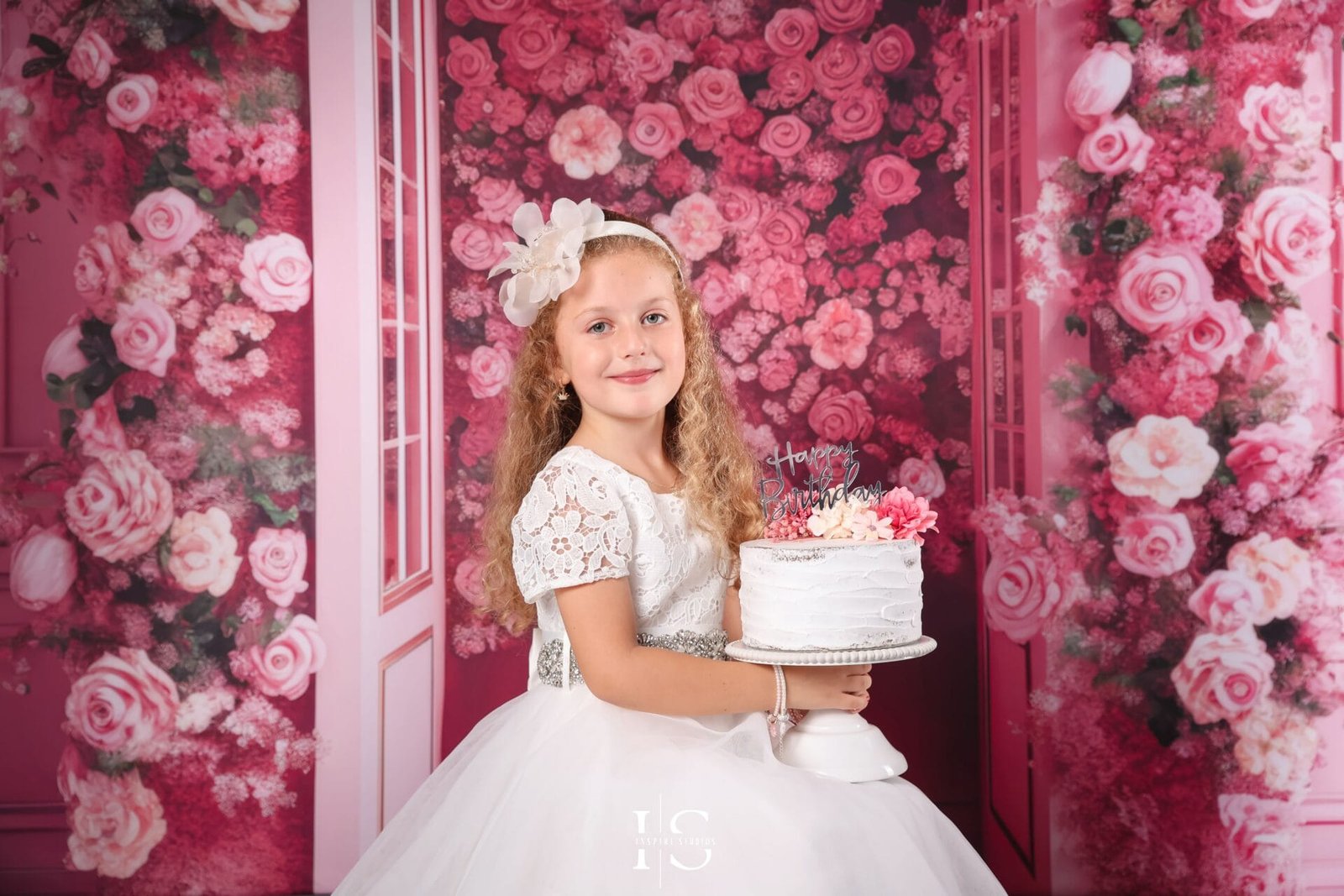 Girl’s birthday photoshoot with a pink flower backdrop at Inspire Studios in London