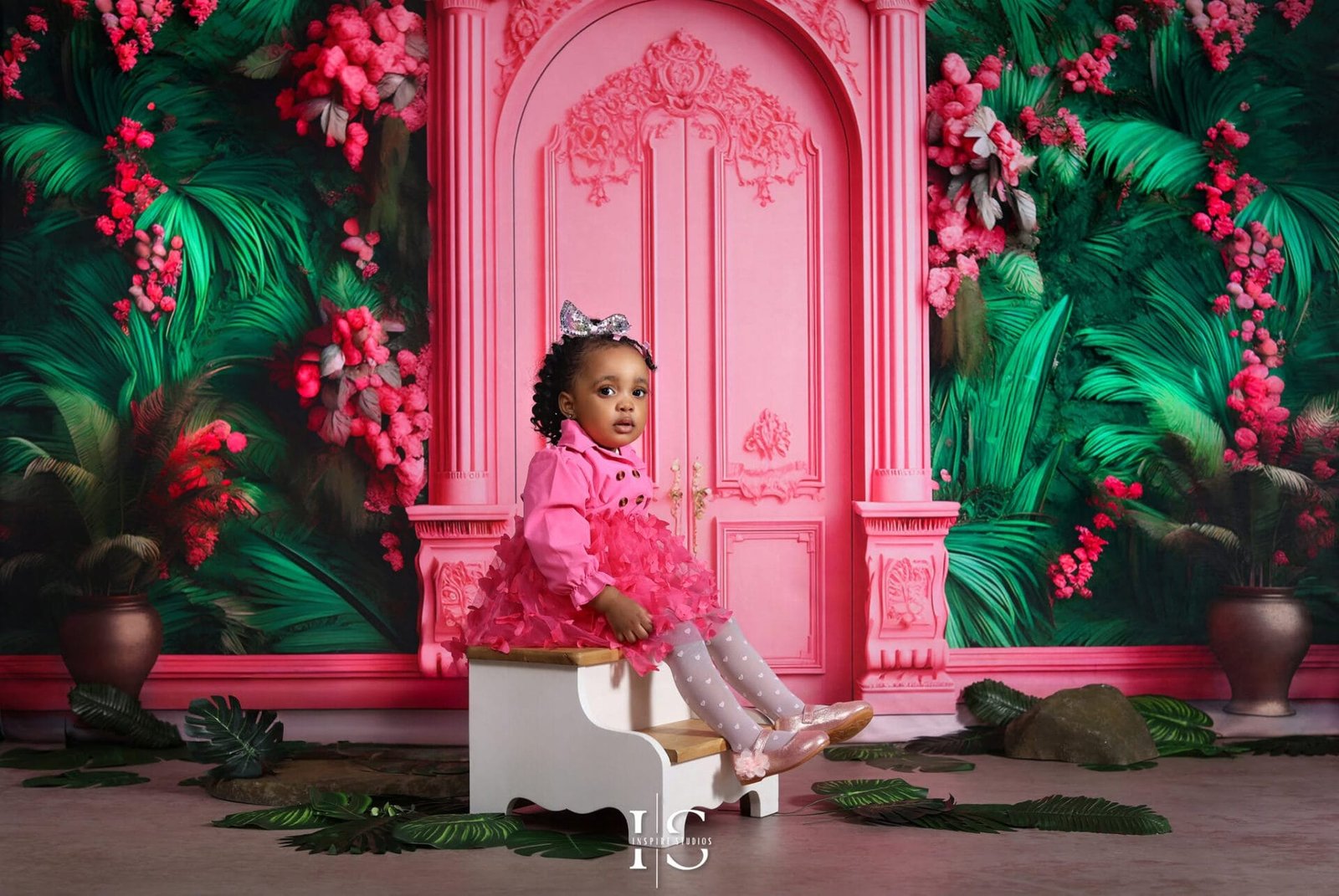 Pink flower Amazon wall backdrop for kids birthday photoshoots at a photography studio in Walthamstow, East London.