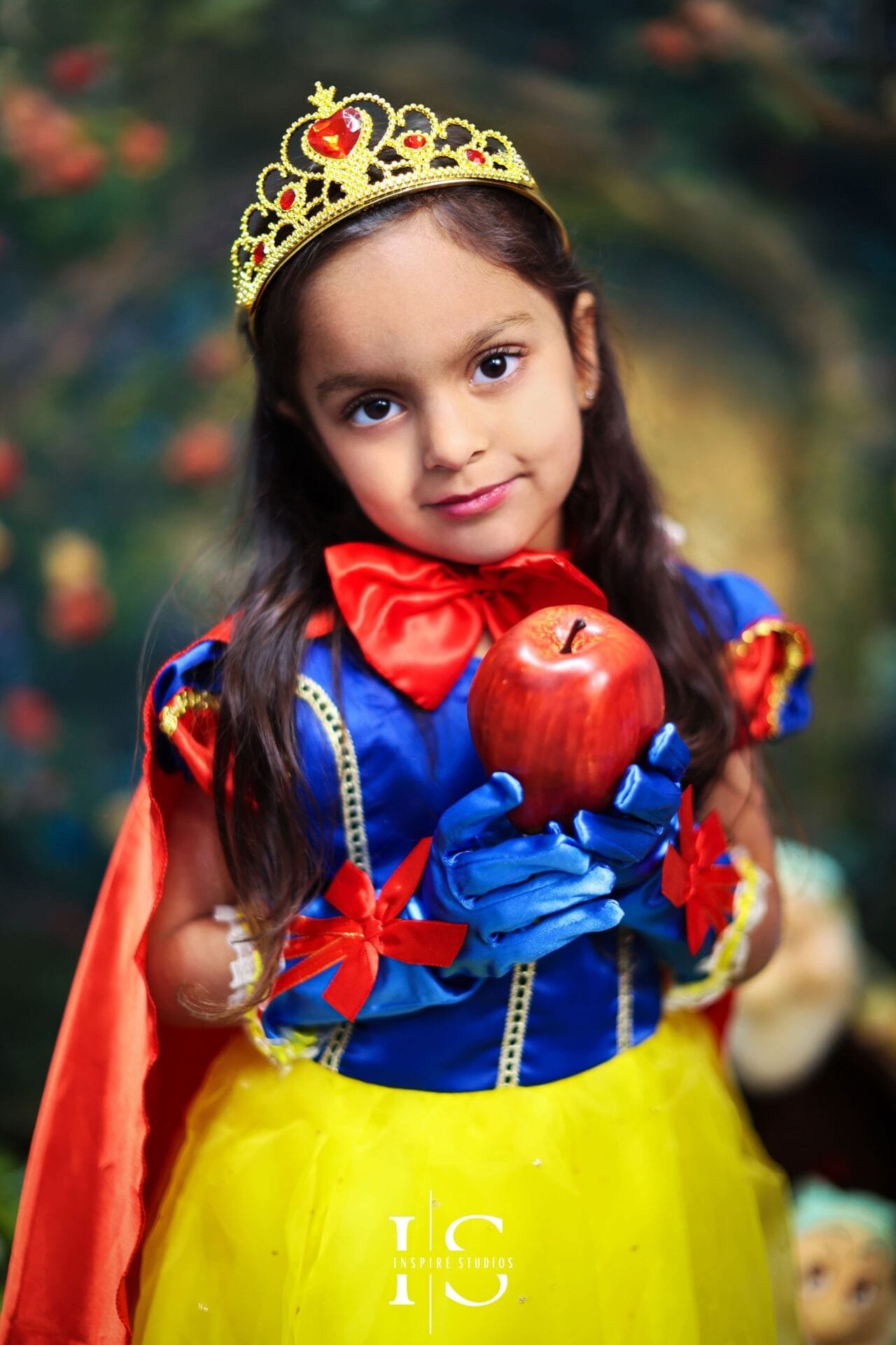 Young girl wearing a Snow White costume during a children’s fairytale photoshoot in London.