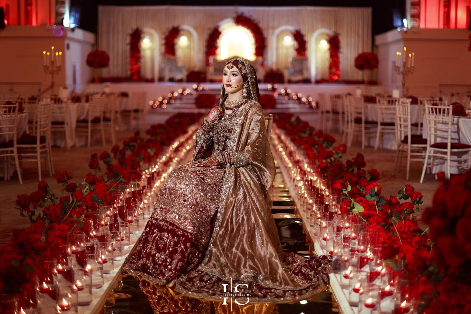 Bridal shots on a candle-lit walkway at Royal Regency, capturing luxury wedding photography in London by Inspire Studios.