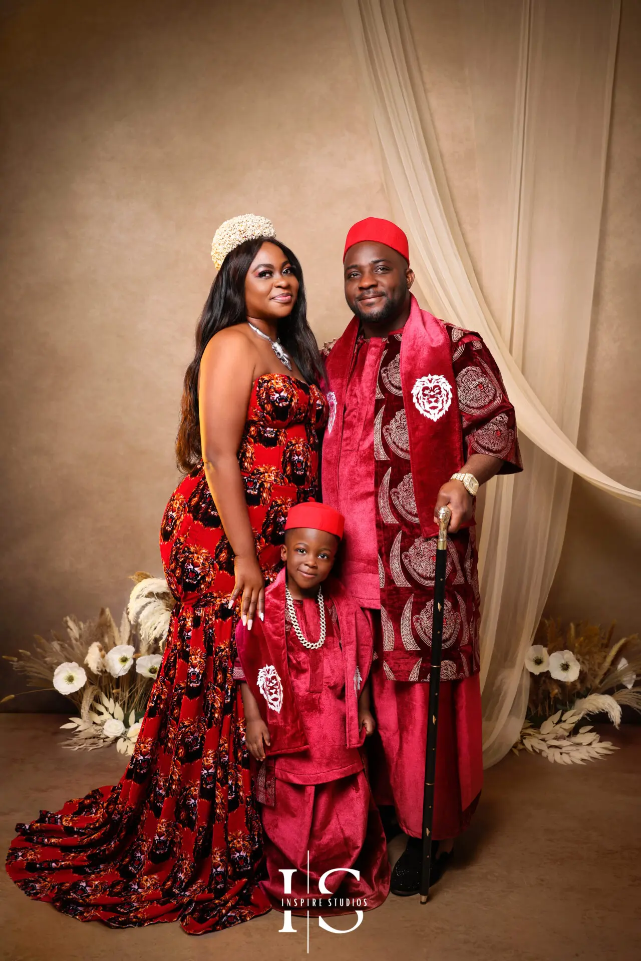 African family traditional photoshoot with parents and children in cultural outfits.