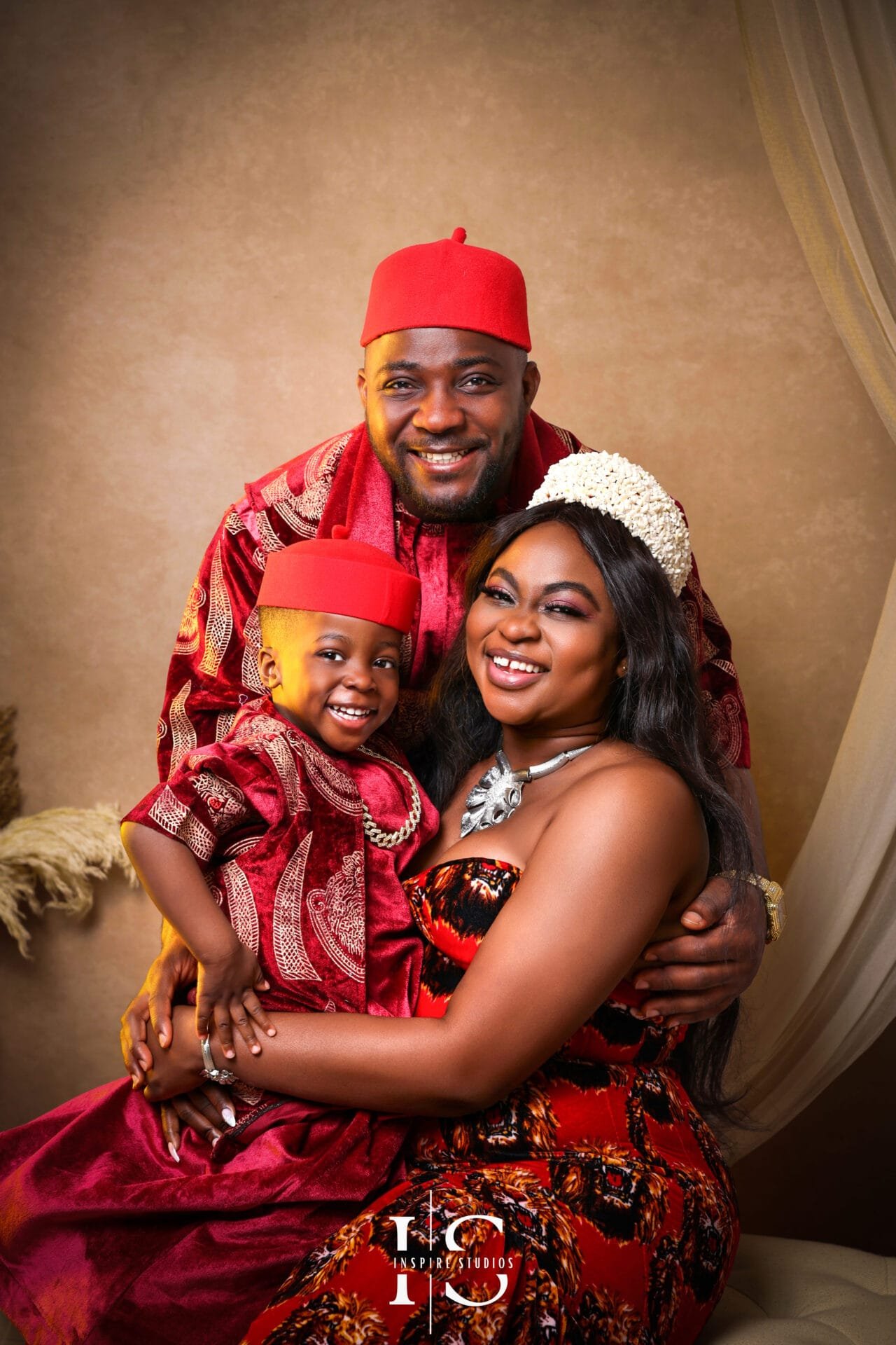 Family wearing African traditional outfits during a studio photoshoot in East London.