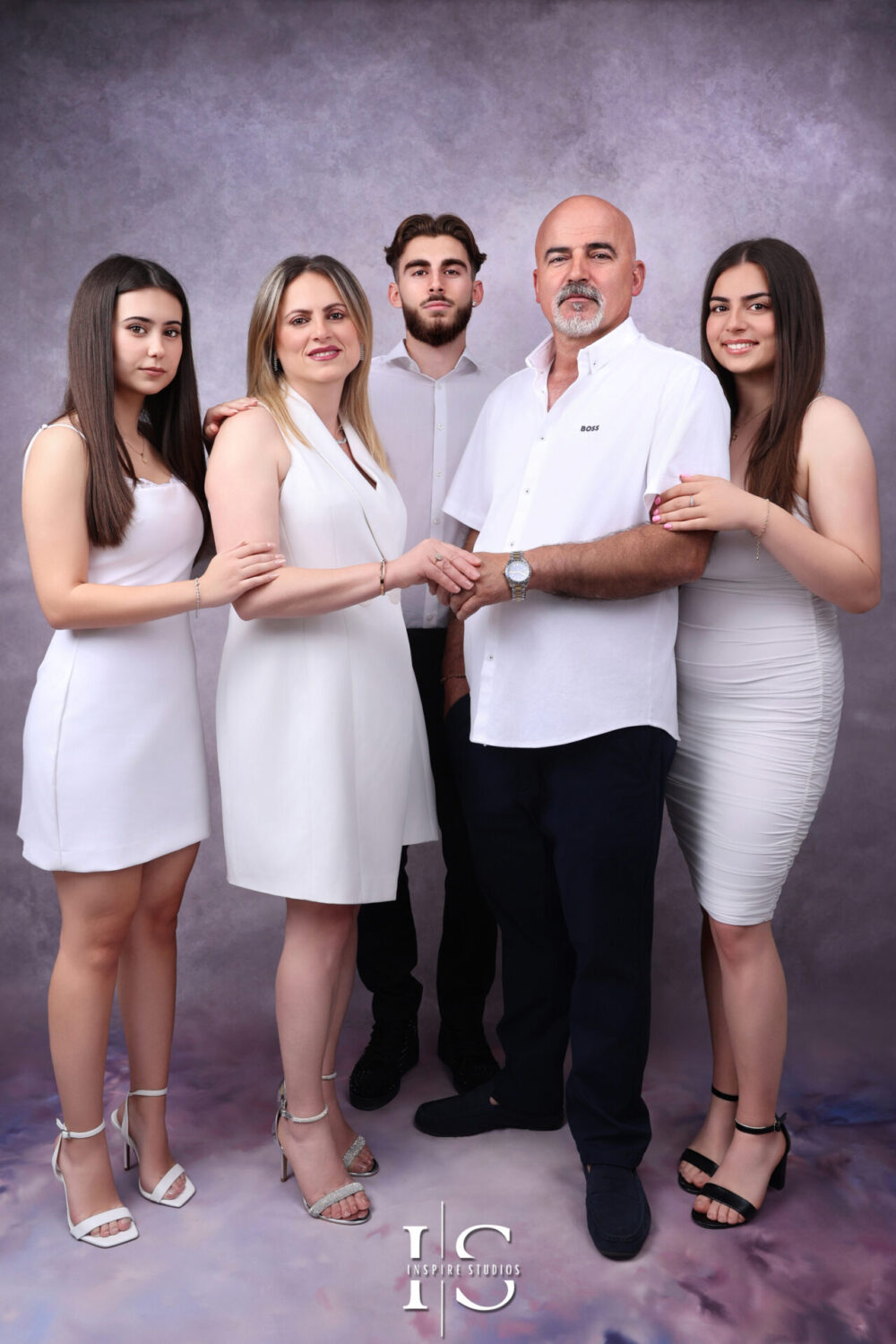 Happy family in an indoor photoshoot with Inspire Studios